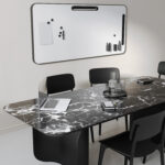 office-meeting-room-with-long-conference-table-chairs-laptop-notebooks-whiteboard-with-notes-wall-3d-render (1)
